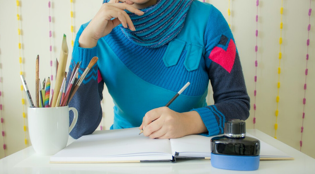 author writing novel at desk