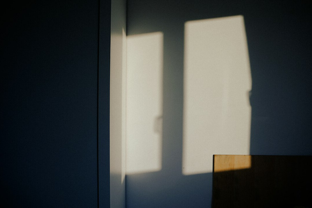 shadowy figure in dark room
